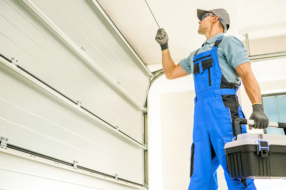 AMS Garage Door Repair man repairing garage door